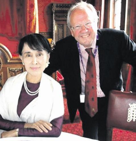TEA FOR TWO: Lord Faulkner of Worcester with Aung San Suu Kyi